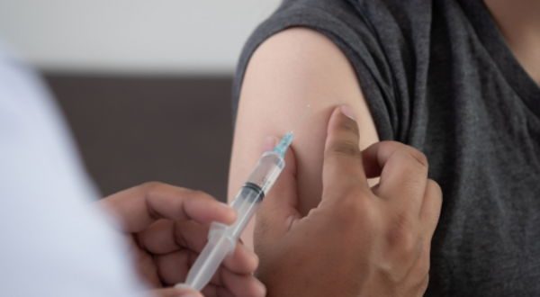 A person getting a shot in a medical office