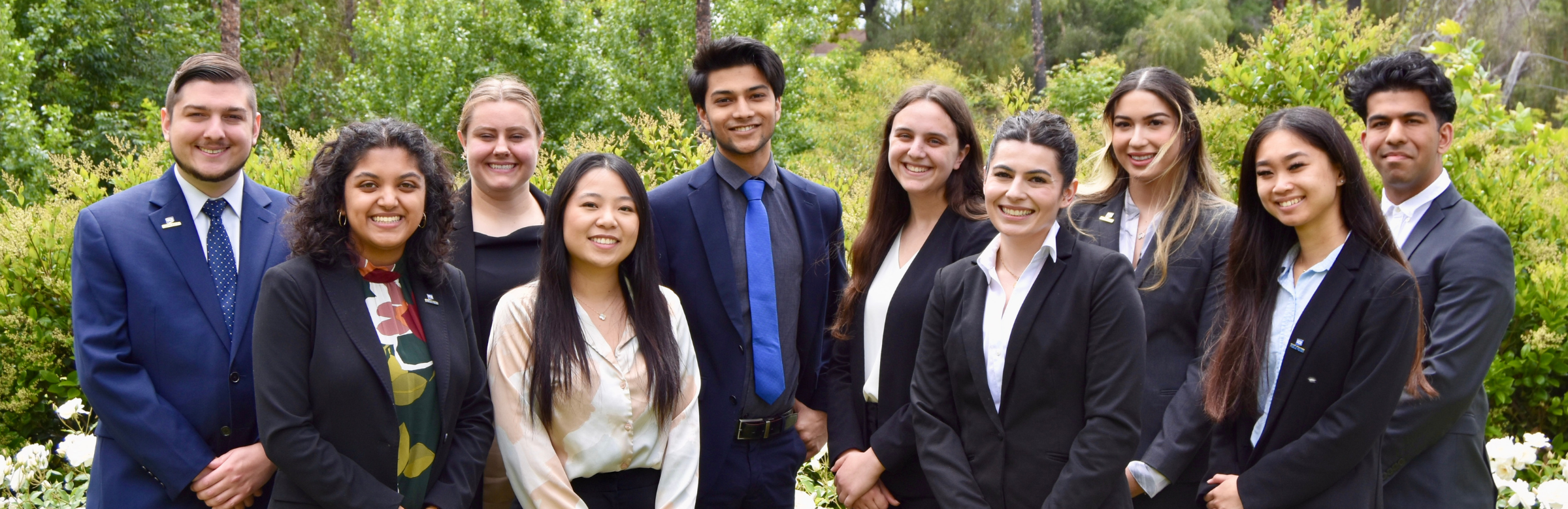 A group of students in professional attire.